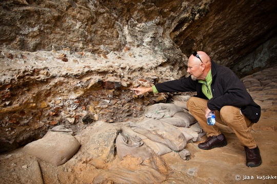 Dr Peter Nilssen indicating Middle Stone Age material in Cave 13B, Pinnacle Point, Mossel Bay, South Africa